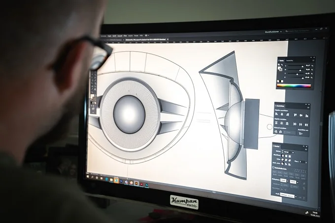 Engineer using 3D modeling software to perform dimensional control for precision in industrial design.