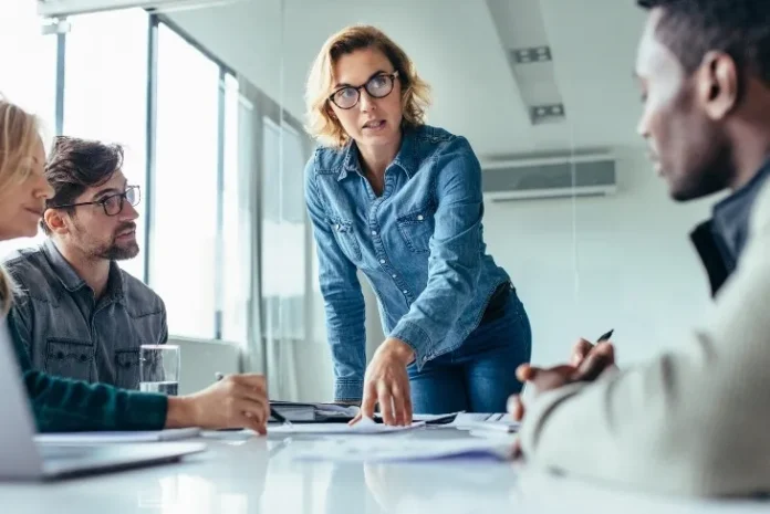 Team collaborating on lead generation strategies in a modern office setting