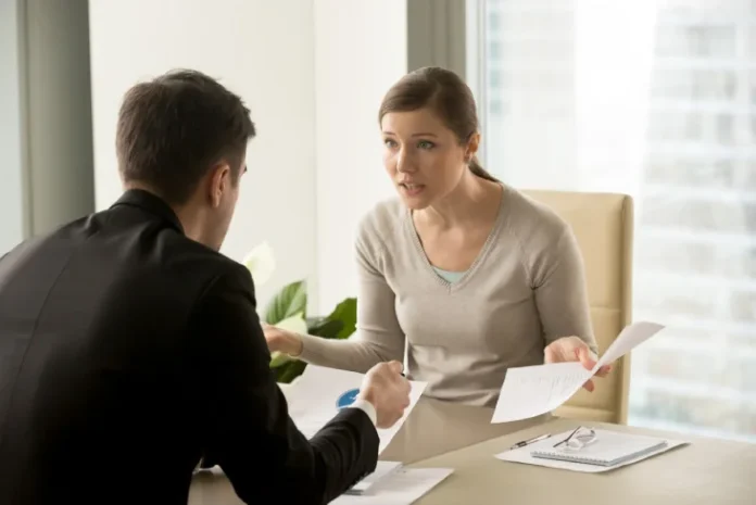 Couple discussing Divorce Mediation in Phoenix with a mediator, highlighting the collaborative process of resolving divorce issues amicably.