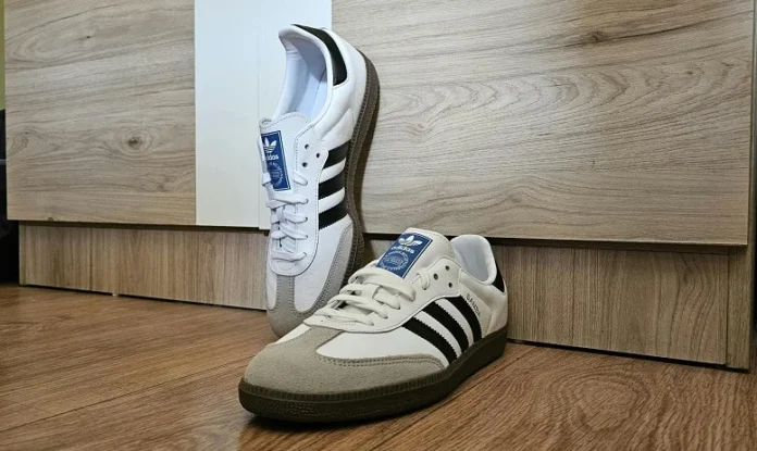Adidas Samba sneakers showcasing a sleek design with black stripes, perfect for casual and sporty styles.