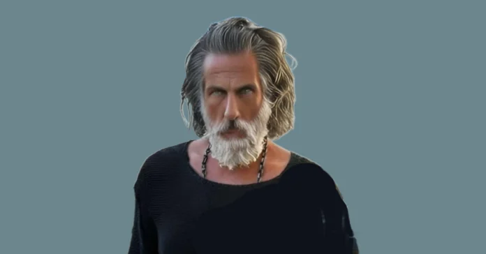 Ilan Tobianah has an estimated net worth of $50 million. Known for his signature Zeus-like silver hair and white beard, he is often seen wearing a black top against a striking teal background.